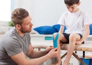 Physical Therapist with Young Boy