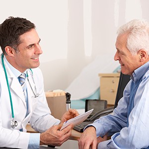 Doctor consulting with male patient.