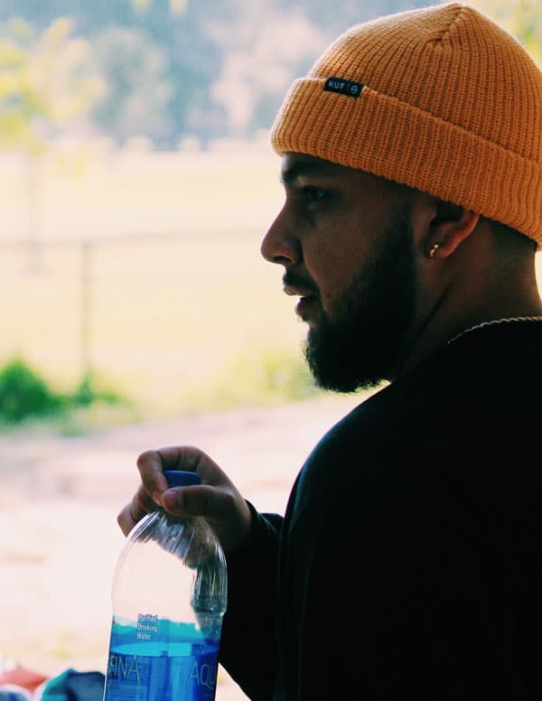 Man drinking water in park